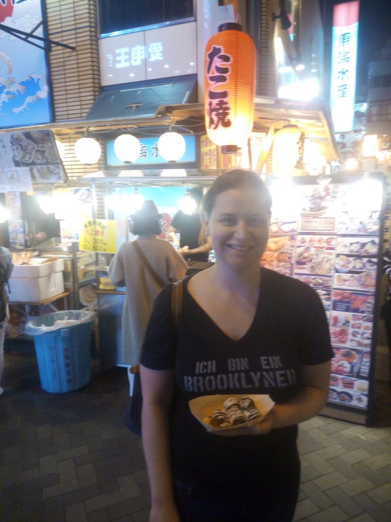 Eating Takoyaki on Dotonburi Street, Osaka, Japan