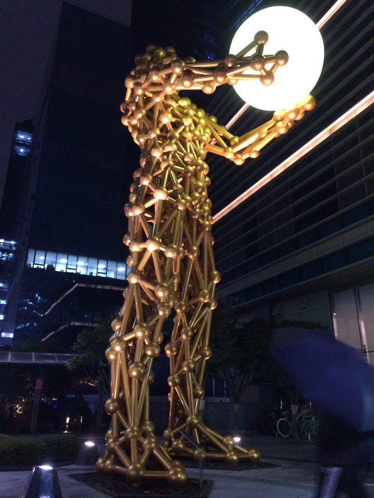 Gold man with orb, Seoul, South Korea