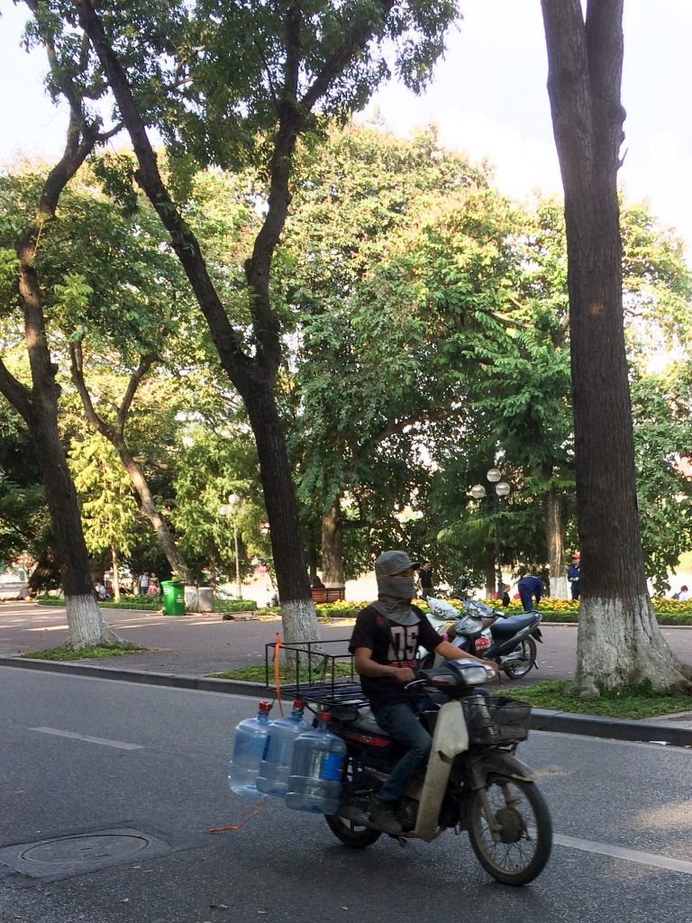 Motorbike with water jugs, Hanoi, Vietnam