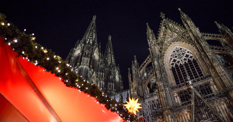 Red tent and Christmas lights outside the Cologne Dom