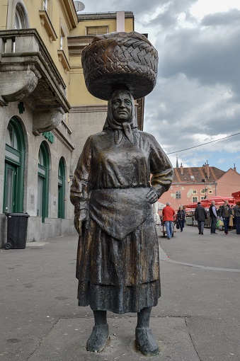Statue of a woman with a basket on her head outside Dolac Market in Zagreb, Croatia