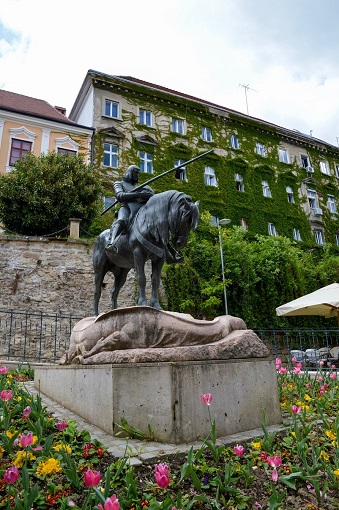Man on a horse statue surrounded by flowers in Upper Town Zagreb