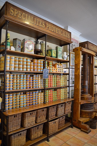 Shelves of beautiful canned food at Les Délices du Luberon in L'Isle-sur-la-Sorgue, France