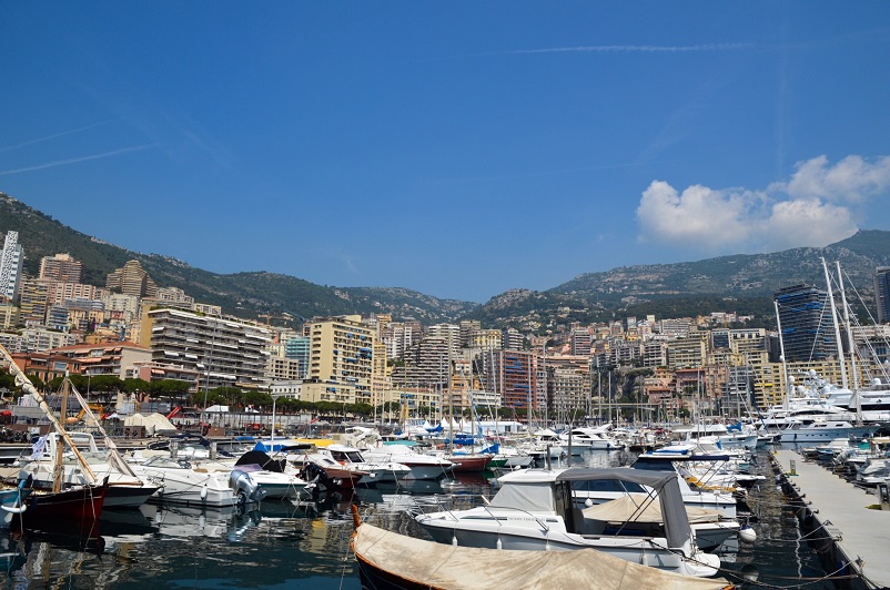 Boats surrounded by buildings in a port in Monaco