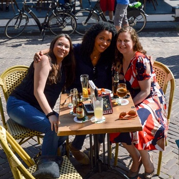 Three women sitting around a table in the Netherlands