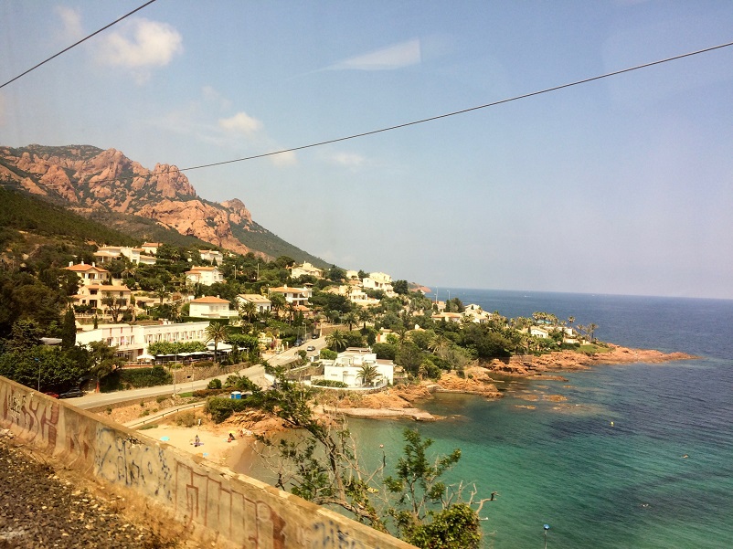 Coastal town and beach and ocean as seen traveling to the South of France by train