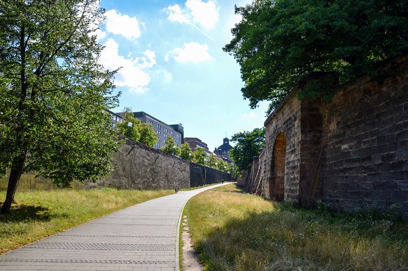 Grassy area flanked by the medieval city walls of Nuremberg, Germany