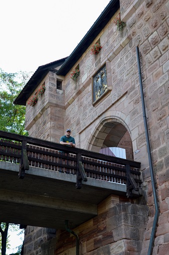 Justin standing on a small wooden bridge on Frauentorturm, part of the old city walls in Nuremberg