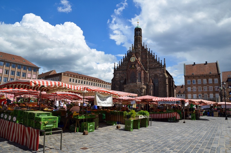 Market stalls and an ornate church in the Hauptmarkt, one of the best things to do in Nuremberg
