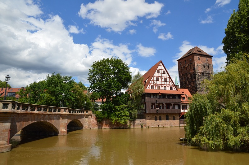 Half-timbered building - Weinstadel - and a bridge on the river in Nuremberg, the most beautiful city in Germany