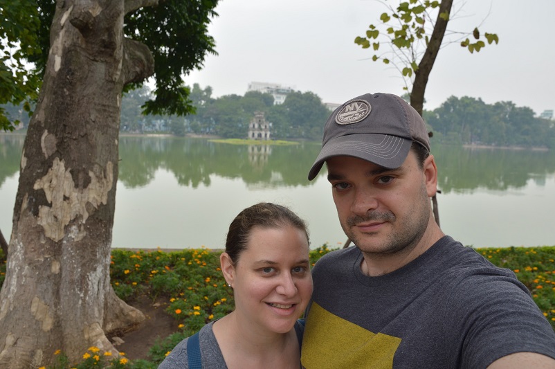 Sarah and Justin standing in front of a lake in Hanoi, Vietnam