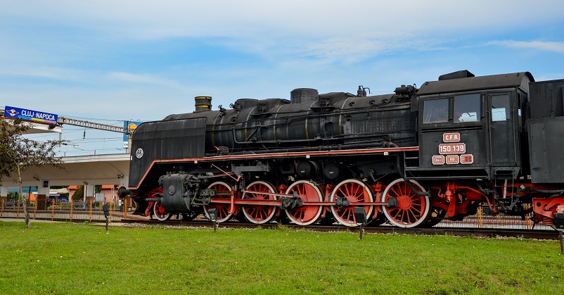 Old black train with red wheels in Romania