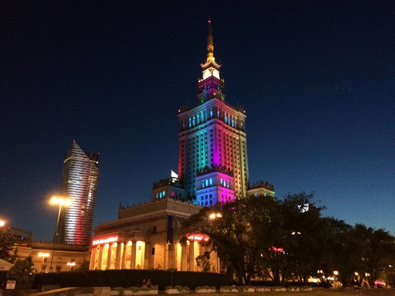 Building lit up in rainbow colors in Warsaw, Poland