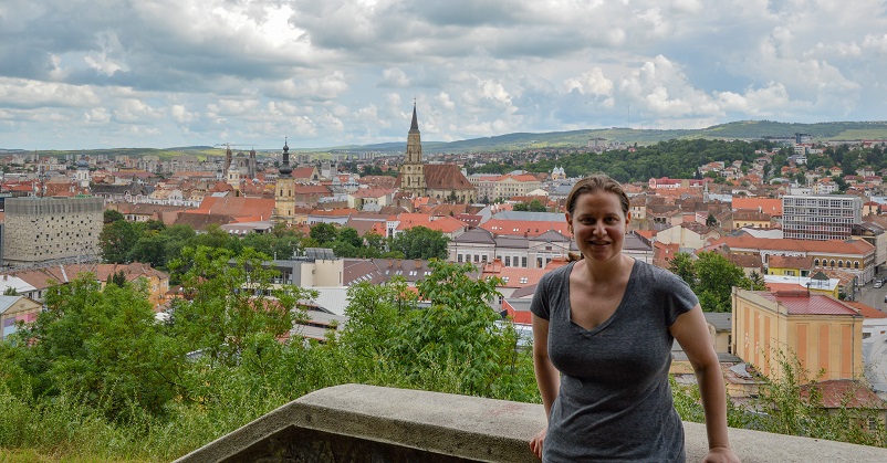 Woman standing in front of view of Cluj, Romania