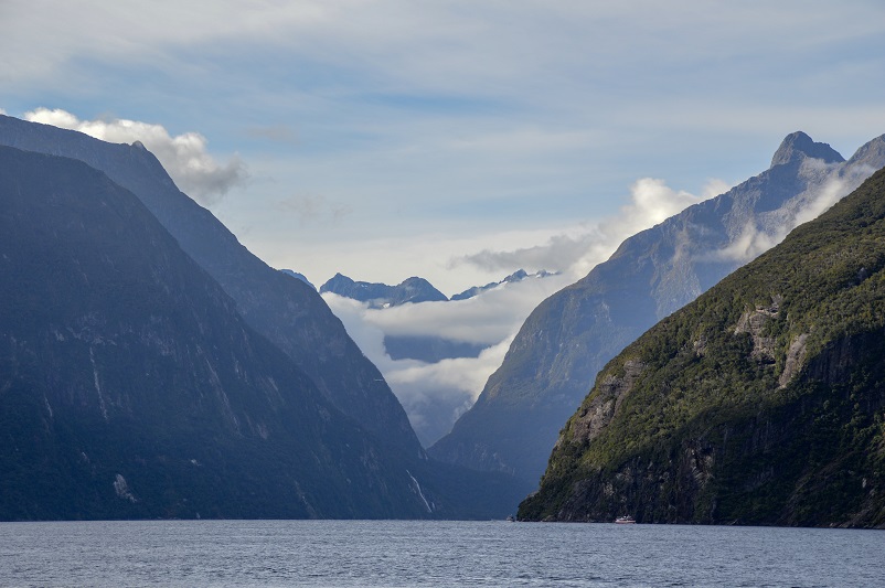 View of mountains and clouds on a Milford Sound cruise
