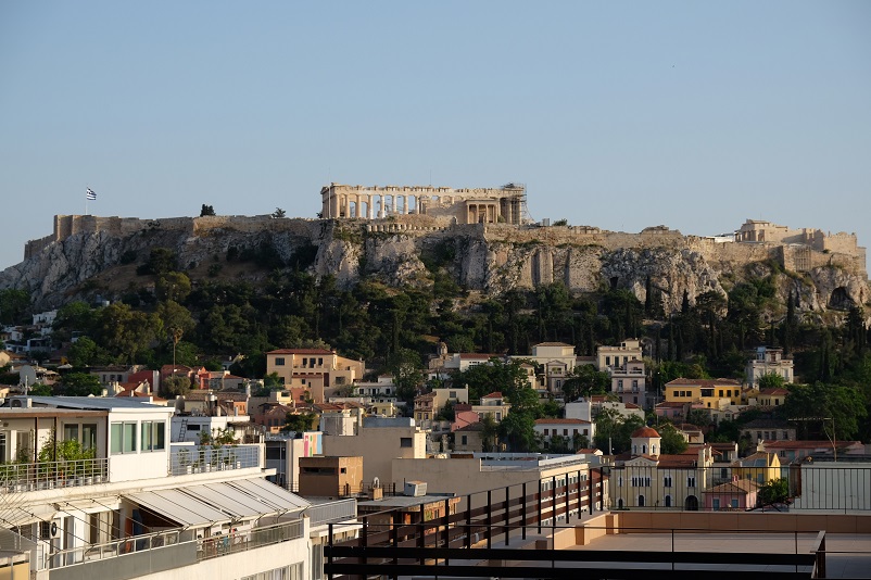 Buildings in the foreground, the Parthenon and Acropolis in the background, Athens, Greece