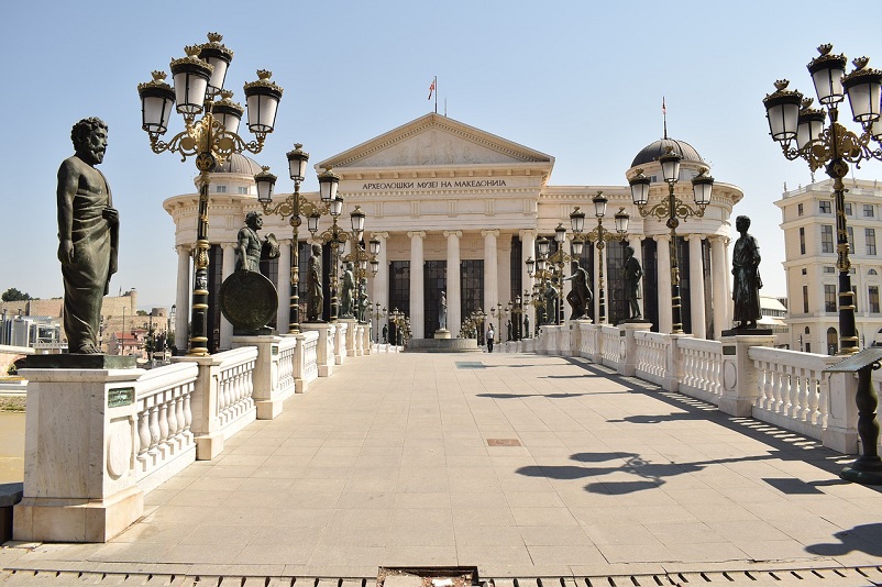 Statues lining a white bridge in Skopje, Macedonia