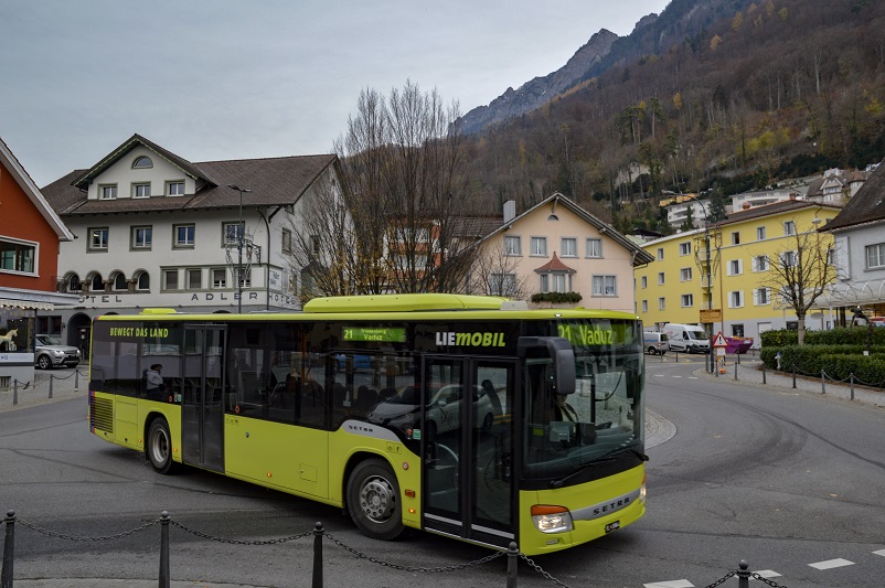 Yellow bus heading to Vaduz, Liechtenstein, one of the more unique day trips from Zurich