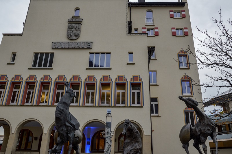 Horse statues in front of a town hall building with a "Rathaus" sign in Vaduz, Liechtenstein