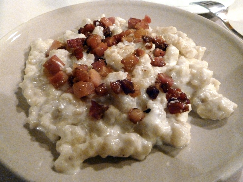 Plate of halusky with lardons in Bratislava, Slovakia