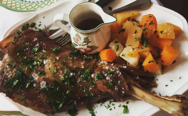 Plate with lamb shank, root veg, and gravy in the Faroe Islands