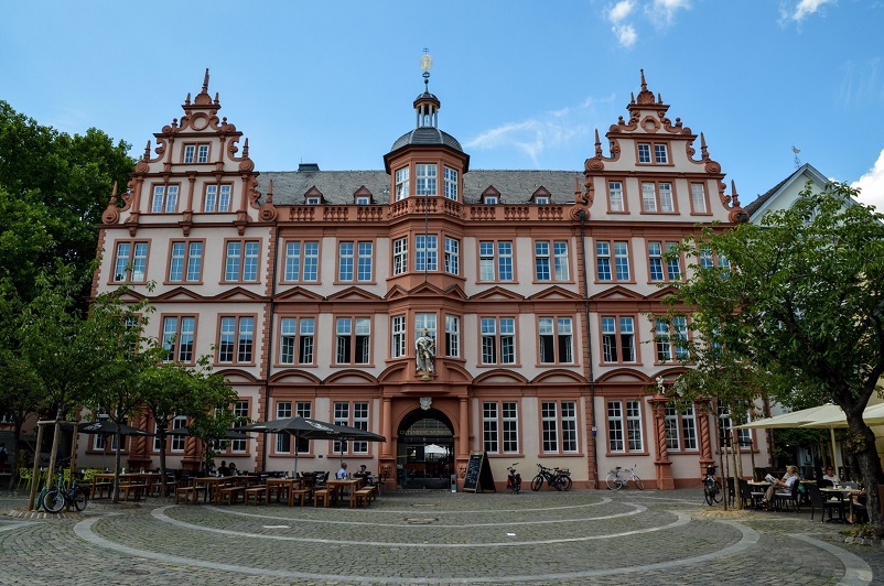 Ornate and grand pink building, the Gutenberg Museum, one of the best things to do in Mainz