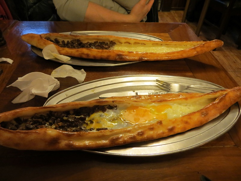 Two Turkish pides and butter wrappers in Istanbul, Turkey