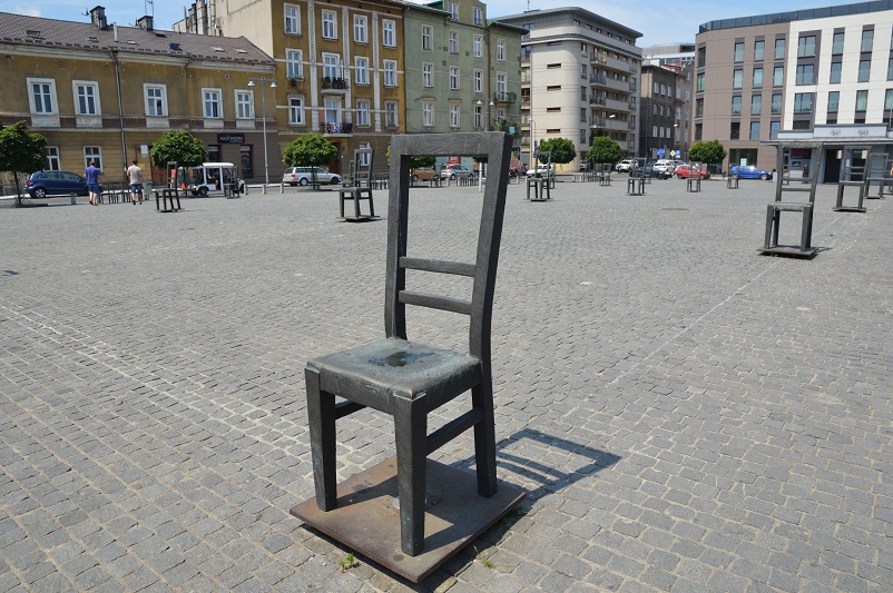 Chair sculptures in an otherwise empty square: Ghetto Heroes Square in Krakow, Poland