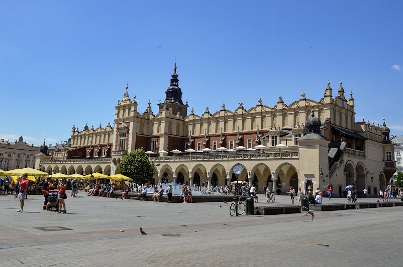 A large pretty building in the middle of a plaza, Cloth Hall in Main Market Square in Krakow