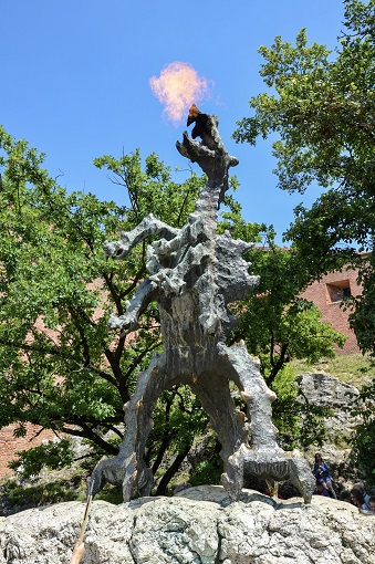 Sculpture of a dragon breathing fire in Krakow