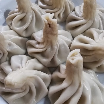 Close-up of eight Chinkhali soup dumplings in Lviv, Ukraine