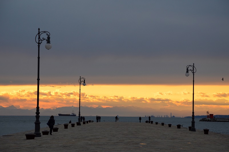 Sunset on a pier leading to Adriatic Sea, Trieste