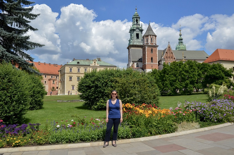 Sarah standing in front of the Wawel Castle grounds in Krakow, Poland