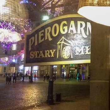 Pierogarnia restaurant sign in front of Wroclaw Rynek at night