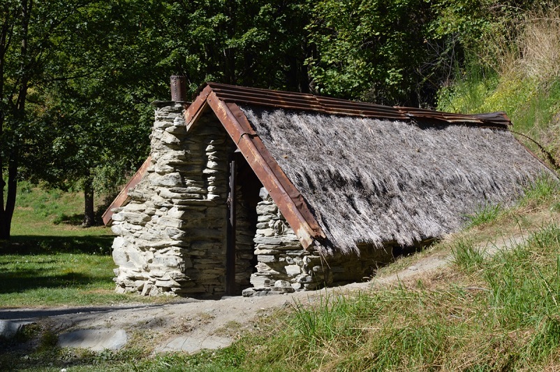 Stone house with thatched hut in the Chinese Settlement in Arrowtown, NZ