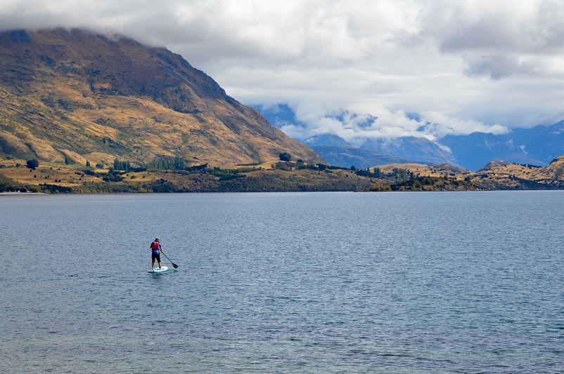 Paddleboarder on Lake Wanaka in New Zealand