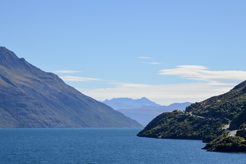 Mountains and a lake with a road on the side: Devil's Staircase in NZ