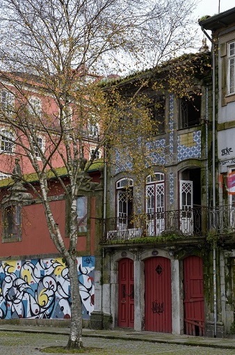 Colorful buildings and a mural in Porto