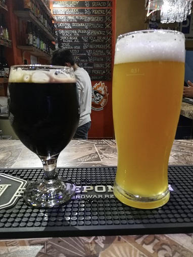 Two glasses of Polish craft beer (one stout, one sour) at Dom Piwa in Poznan