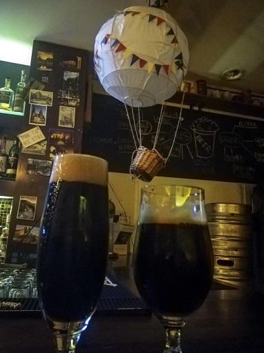 Close-up of two stouts in front of a mini hot air balloon at Lot Chniela in Poznan