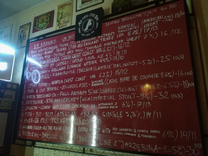 Handwritten tap list with Polish craft beer at Piwna Stopa in Poznan