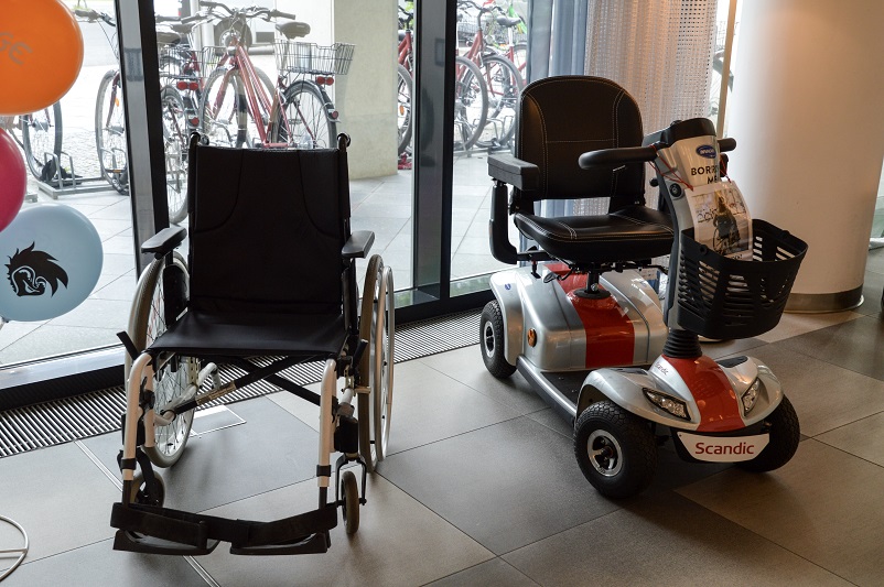 One manual wheelchair and one electric scooter in the lobby of the Scandic Berlin Potsdamer Platz
