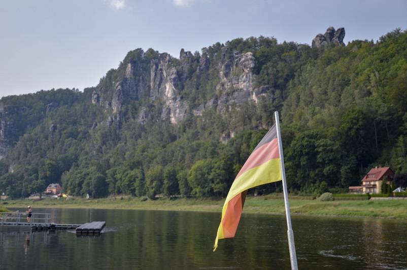 German flag in front of Bastei in Saxon Switzerland, day trip from Dresden