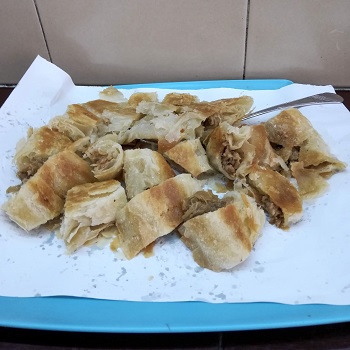 Belgrade food: ,eat burek on a blue tray