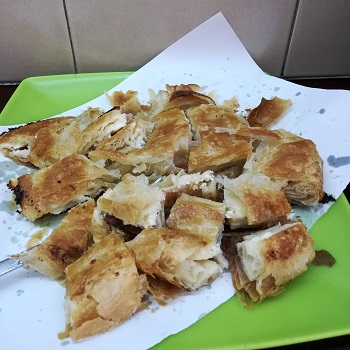 Belgrade food: cheese burek on a green tray