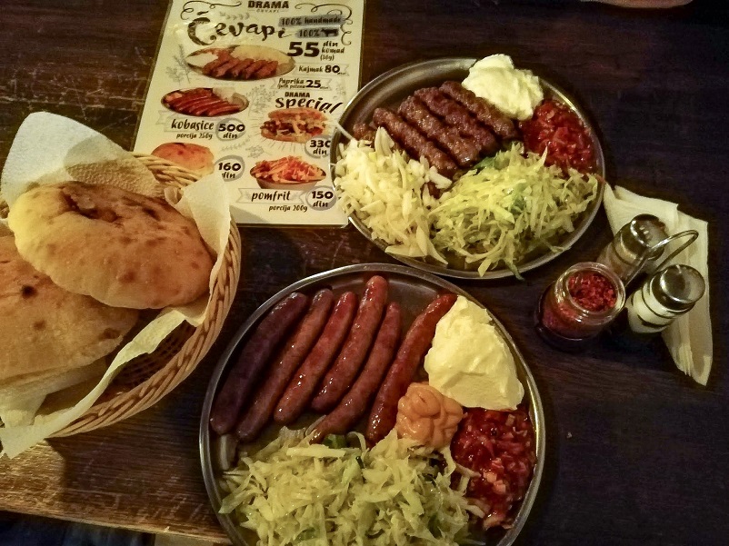 Sausage plates and bread at Drama, one of our recommended Belgrade restaurants