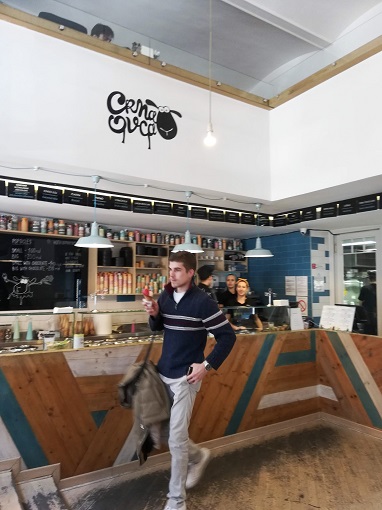 Man enjoying an ice cream cone at Crna ovca in Belgrade