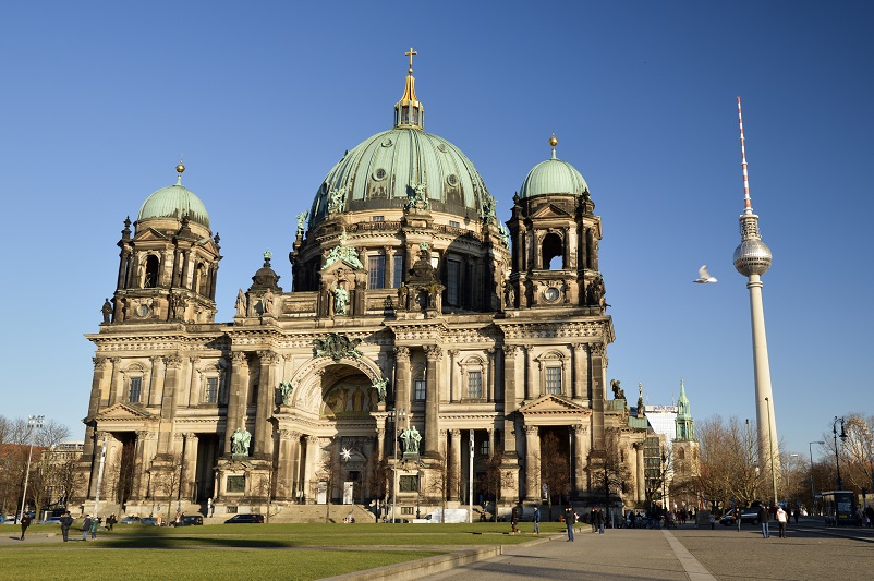 The Berliner Dom and the TV Tower against a bright blue sky in Berlin