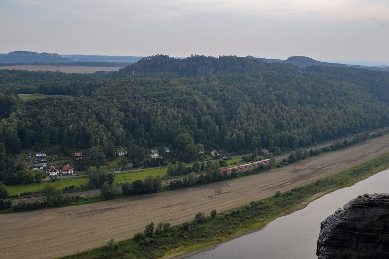 View of a train along the Elbe River seen on our Bastei Bridge hike
