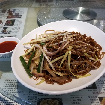 Plate of noodles eaten on a Shanghai food tour